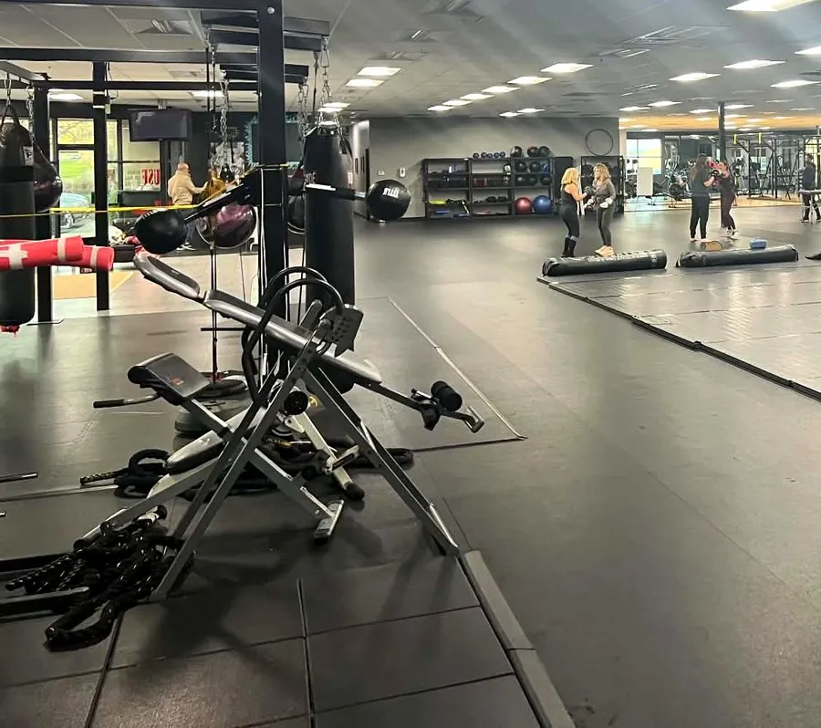 The open gym floor with equipment and members training