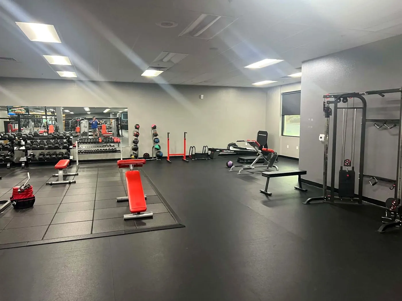 Dumbbell and cable machine area at the Valor Fit Society gym